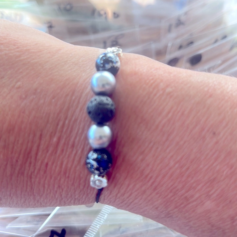 Women’s slipknot bracelet. Silver blue crackle and lava rock.
